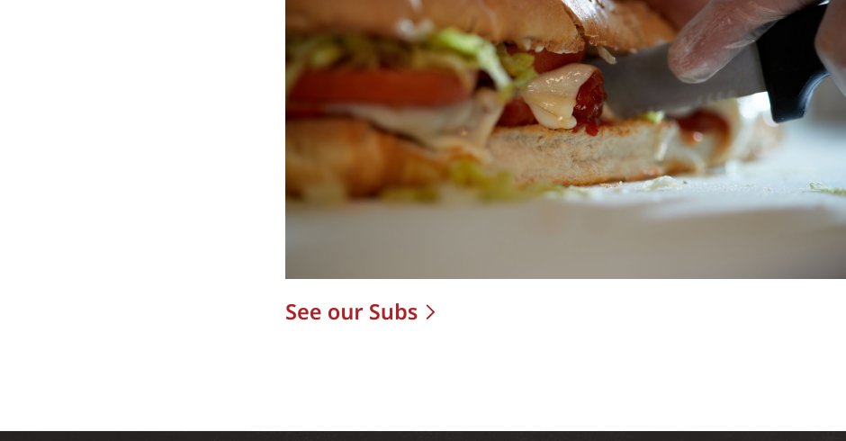 Fresh sub sandwich being sliced
