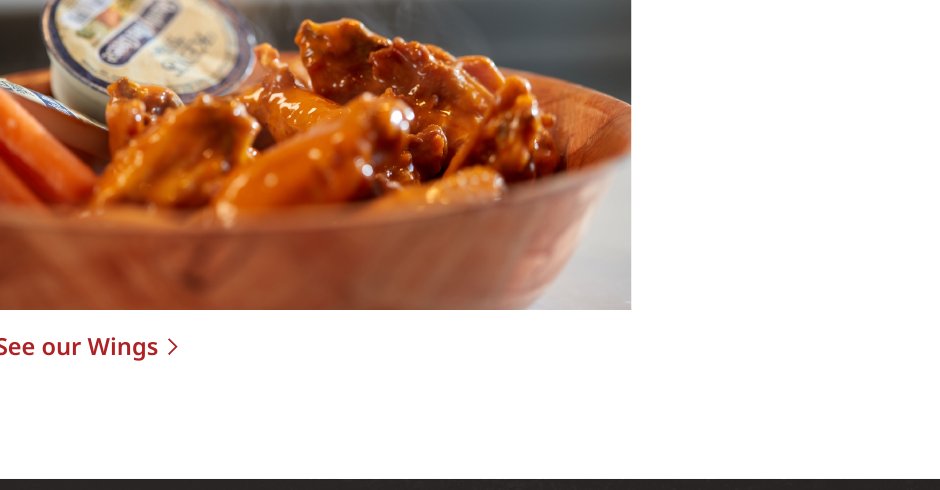 Bowl of freshly sauced chicken wings